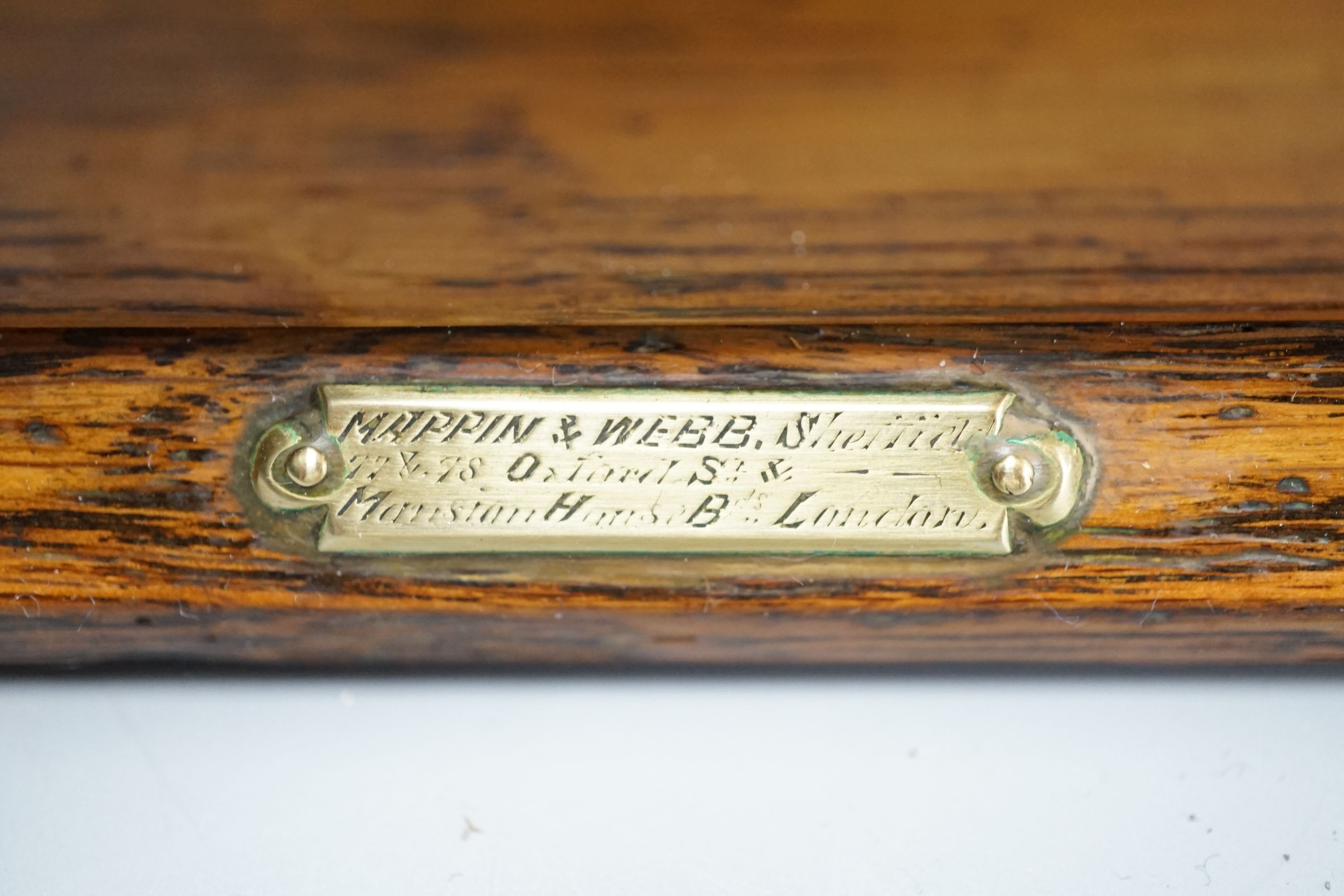 A Victorian Betjemann Patent oak three-bottle Tantalus - 34.5cm high